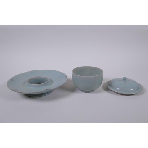 19 - A Chinese Ru ware style tea set comprising a tea bowl, cover and petal shaped saucer, 18cm diameter