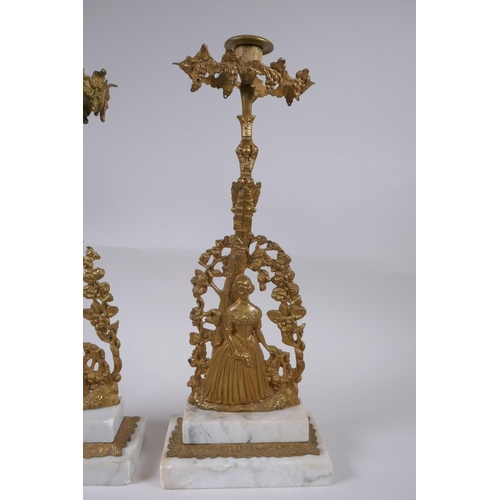 22 - A near pair of antique ormolu and marble candlesticks in the form of a lady with a lyre, 41cm high