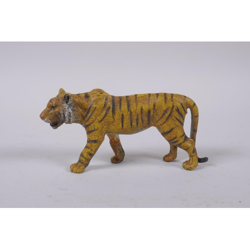 23 - A cold painted bronze tiger, after Bergmann, 10cm long