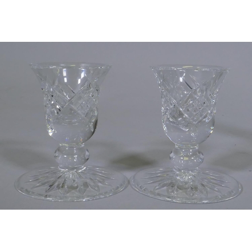 24 - A pair of Waterford crystal glass dwarf candlesticks, 8cm high, a Stephens glass vase, Dartington st... 