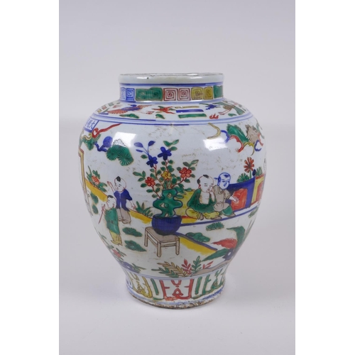 31 - A wucai porcelain jar decorated with boys playing in a garden, Chinese Jiajing 6 character mark to l... 