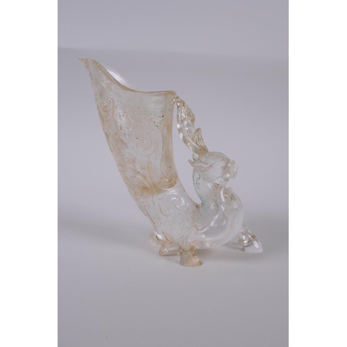 33 - A Chinese moulded glass libation cup in the form of a mythical deer, 14cm high