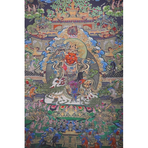 34 - A Tibetan printed thangka depicting a wrathful deity, 66 x 89cm