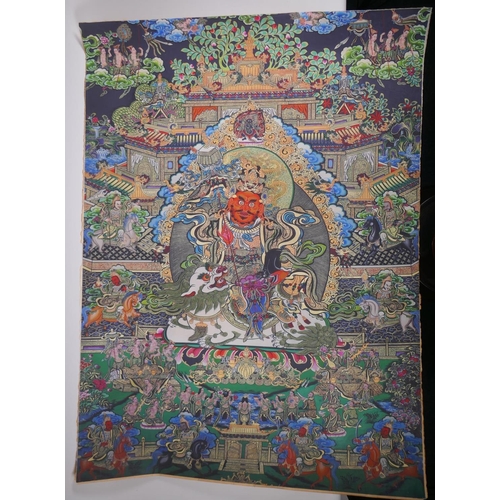 34 - A Tibetan printed thangka depicting a wrathful deity, 66 x 89cm