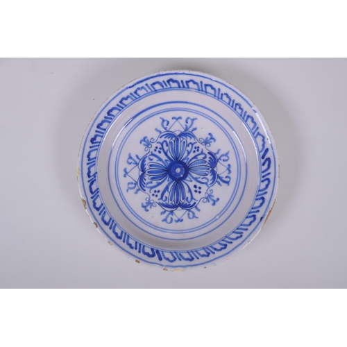 38 - A late C18th/early C19th Delft tin glazed blue and white pottery bowl with floral decoration, and a ... 