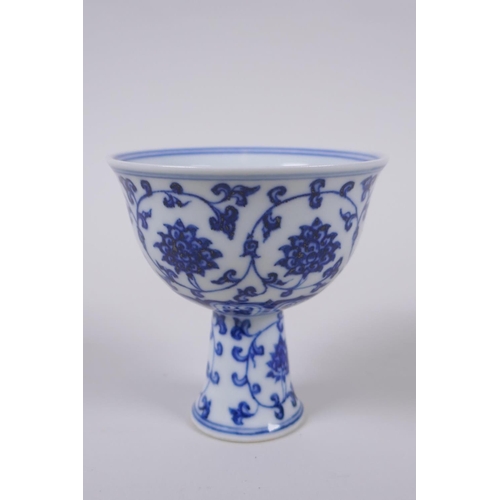 40 - A blue and white porcelain stem cup with scrolling lotus flower decoration, Chinese Xuande 6 charact... 