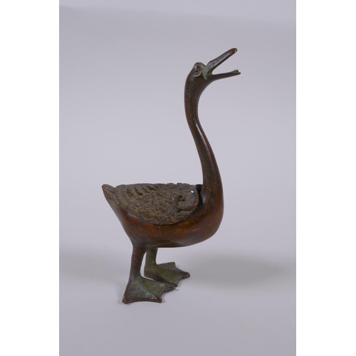 41 - A Chinese bronze censer in the form of a duck, indistinct mark to belly, 12cm high