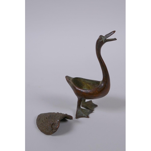 41 - A Chinese bronze censer in the form of a duck, indistinct mark to belly, 12cm high