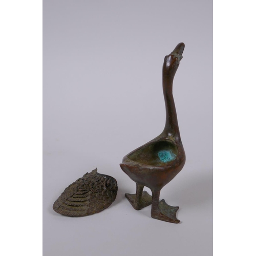 41 - A Chinese bronze censer in the form of a duck, indistinct mark to belly, 12cm high