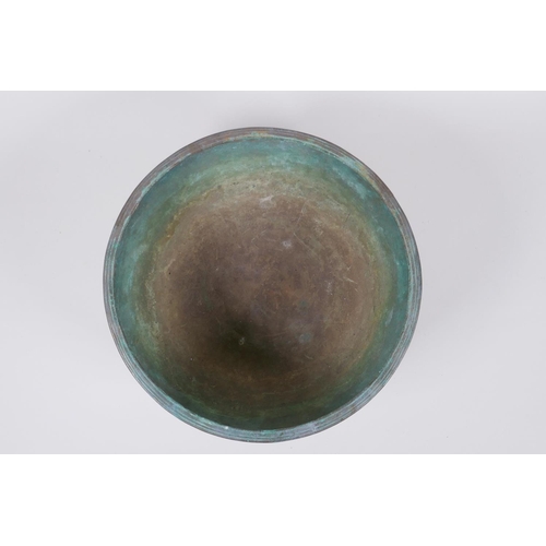 42 - A C19th Tibetan hammered silvered bronze singing bowl, 27cm diameter a/f