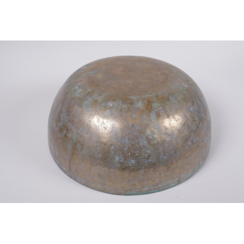 42 - A C19th Tibetan hammered silvered bronze singing bowl, 27cm diameter a/f