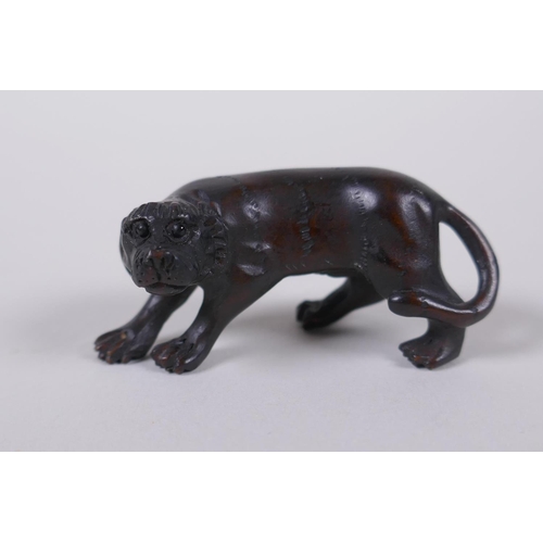 44 - A Japanese carved boxwood tiger netsuke, 5cm long