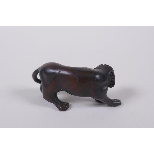 44 - A Japanese carved boxwood tiger netsuke, 5cm long