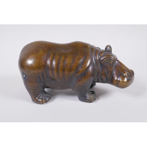 46 - A filled bronze figure of a hippopotamus, 21cm long