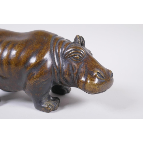 46 - A filled bronze figure of a hippopotamus, 21cm long