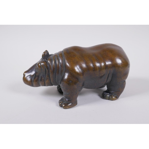 46 - A filled bronze figure of a hippopotamus, 21cm long