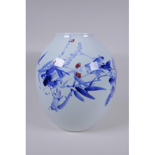 48 - A Japanese Meiji period blue and white porcelain vase decorated with a shrub in bloom, character ins... 