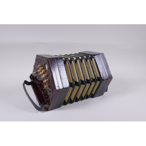 5 - A late C19th/early C20th twenty-one key hexagonal concertina by Lachenal & Co, London, pierced e... 