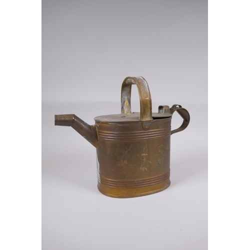 59 - An antique brass watering can, 25cm high x 32cm long