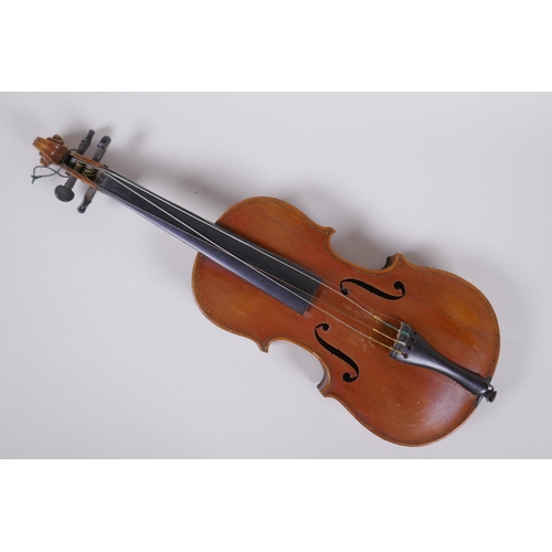 64 - An antique half size violin with a two piece back and ebony finger board, 46cm long 