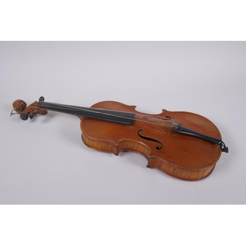 64 - An antique half size violin with a two piece back and ebony finger board, 46cm long 