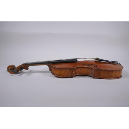 64 - An antique half size violin with a two piece back and ebony finger board, 46cm long 