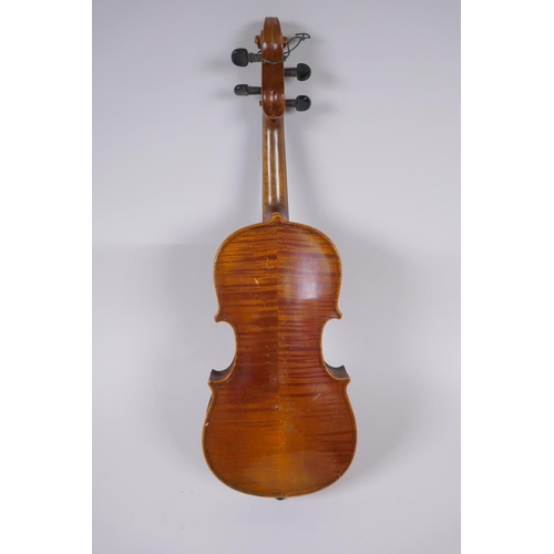 64 - An antique half size violin with a two piece back and ebony finger board, 46cm long 