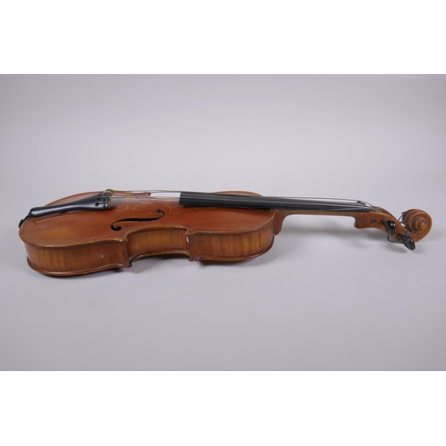 64 - An antique half size violin with a two piece back and ebony finger board, 46cm long 