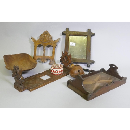 66 - A carved wood bookslide, photo frame, tray and treen, a carved brazil nut husk etc, slide 30 x 13cm