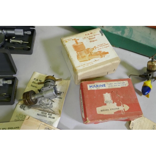 81 - A Davies Charlton model marine diesel engine, a Frog Aero engine, and another on stand, an engineer'... 