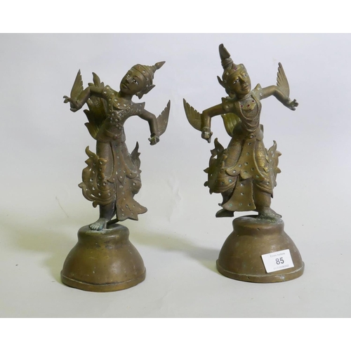 85 - A pair of Siamese bronze dancing figures, with inset glass eyes, and mirrored glass decoration, 29cm... 