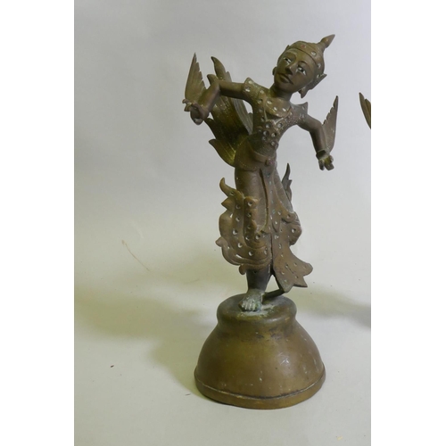 85 - A pair of Siamese bronze dancing figures, with inset glass eyes, and mirrored glass decoration, 29cm... 