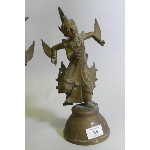 85 - A pair of Siamese bronze dancing figures, with inset glass eyes, and mirrored glass decoration, 29cm... 