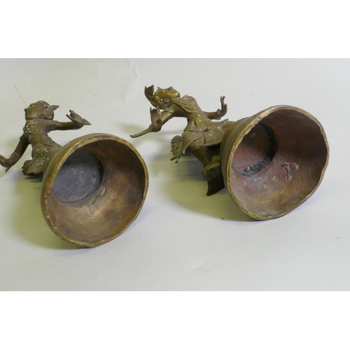 85 - A pair of Siamese bronze dancing figures, with inset glass eyes, and mirrored glass decoration, 29cm... 