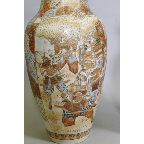 87 - A pair of Meiji period Satsuma vases, decorated with warriors, 40cm high