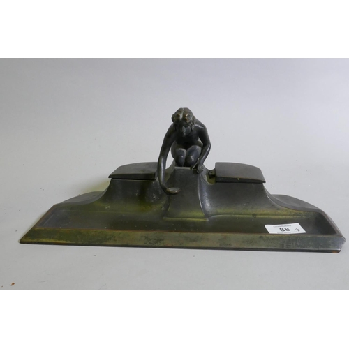 88 - An Art Deco patinated metal desk stand with two inkwells, AF, loss to corner and lacks glass well, 3... 