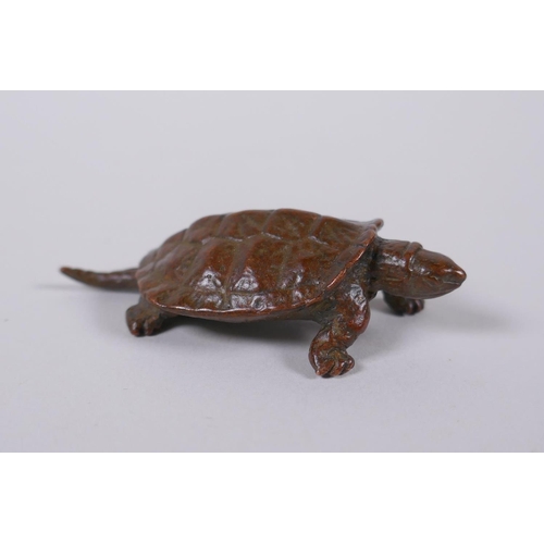 90 - A Japanese style bronze okimono tortoise, impressed mark to base, 6cm long