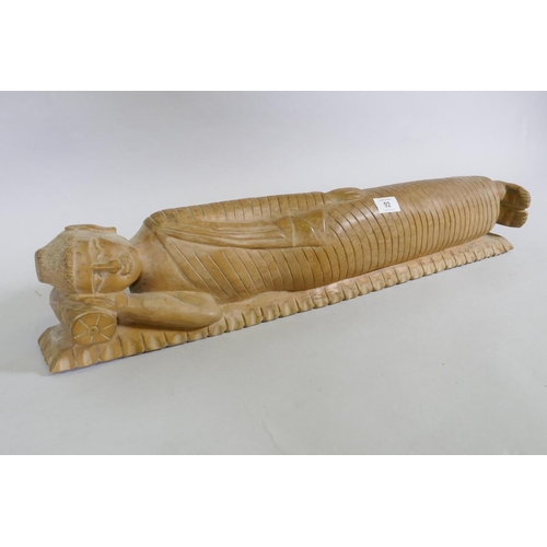 92 - A carved wood figure of sleeping Buddha, 72cm long