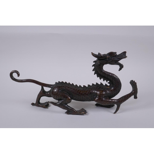 97 - A Chinese filled bronze dragon, 31cm long