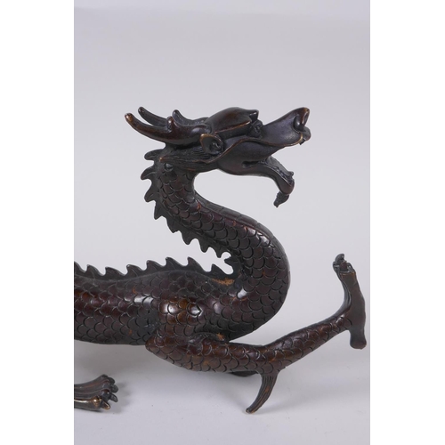 97 - A Chinese filled bronze dragon, 31cm long