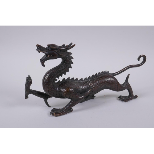 97 - A Chinese filled bronze dragon, 31cm long