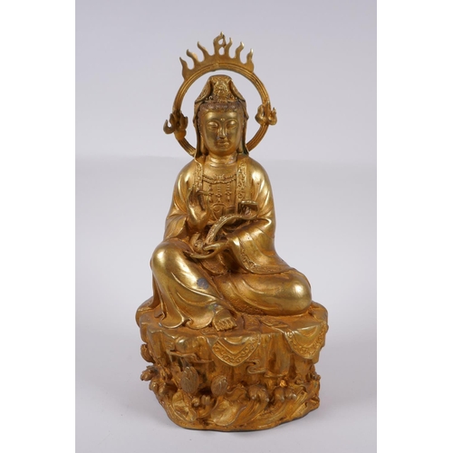 98 - A Chinese gilt bronze figure of Quan Yin, 30cm high