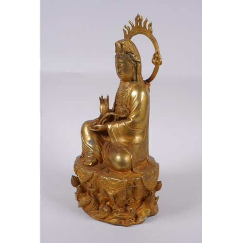 98 - A Chinese gilt bronze figure of Quan Yin, 30cm high