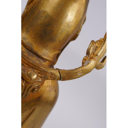 98 - A Chinese gilt bronze figure of Quan Yin, 30cm high