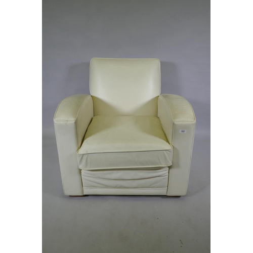 1131 - A contemporary club style armchair with leatherette cover