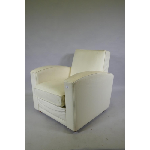 1131 - A contemporary club style armchair with leatherette cover