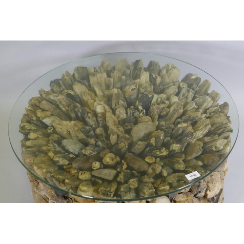 1132 - A driftwood glass topped coffee table, 74cm diameter, 40cm high