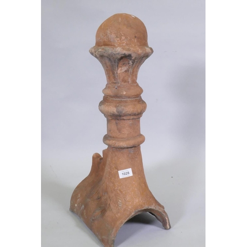 1147 - A terracotta ridge tile finial, 63cm high