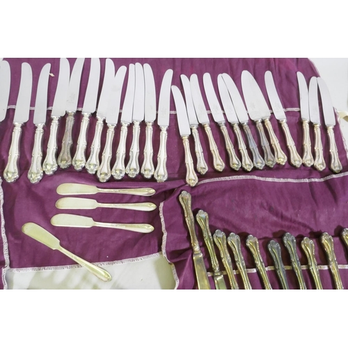 641 - A Mappin & Webb twelve place part cutlery service, a pair of toast racks with Royal cypher, Cohr... 