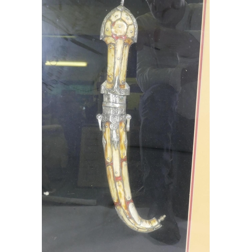 348 - An Arab Jambiya dagger, mounted in a gilt frame, 55 x 80cm